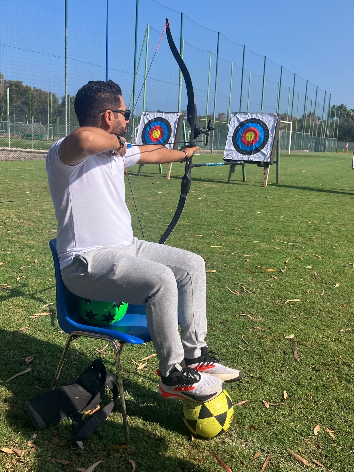 Coach balancing on a football